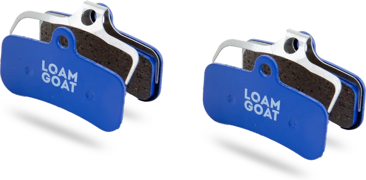 A pair of Loam Goat Trail pads with blue backplates
