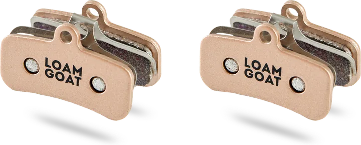 A pair of Loam Goat Sintered pads with gold backplates