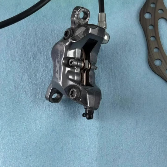 Installing Loam Goat finned disc brake pads into a Shimano caliper, including what the black plastic clips do
