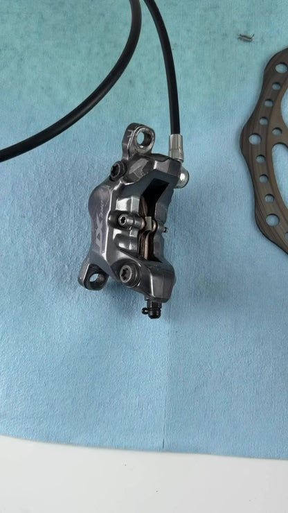 Installing Loam Goat finned disc brake pads into a Shimano caliper, including what the black plastic clips do